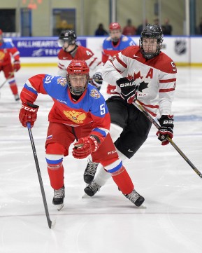 WHITBY, - Dec 14, 2015 -  Game #4 - Russia vs. Canada East at the 2015 World Junior A Challenge at the Iroquois Park Recreation Complex, ON. Nikolay Kovalenko #51 of Team Russia and Adam Smith #5 of Team Canada East follow the play during the first period. (Photo: Shawn Muir / OJHL Images)