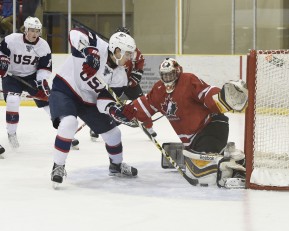 WELLINGTON, - Dec 11, 2015 -  Exhibition Game 2- Team USA vs Team Canada East at the 2015 World Junior A Challenge at the Wellington District Community Centre, ON. Colton Point #1 of Team Canada East battles for control with Max Zimmer #6 of Team United States during the first period. (Photo: Andy Corneau / OJHL Images)