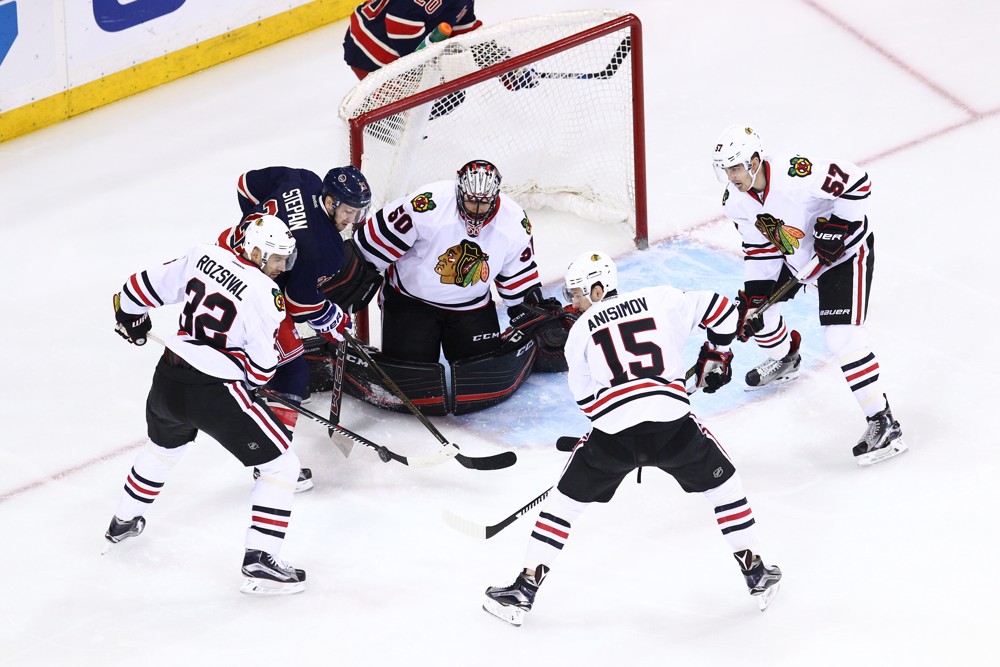 February 17, 2016: New York Rangers Center Derek Stepan (21) [6917] slaps at a rebound off of Chicago Blackhawks Goalie Corey Crawford (50) [3760] during an original six match-up between the Chicago Blackhawks and the New York Rangers at Madison Square Garden in New York, NY. (Photo by David Hahn/Icon Sportswire)