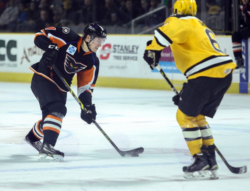 March 13, 2015: Phantoms Robert Hagg (4) unloads a slapshot in front of Bruins defense men Chris Casto (6) in the 2-1 Lehigh Valley Phantoms shootout victory over the Providence Bruins at the Dunkin Donuts Center in Providence, RI.