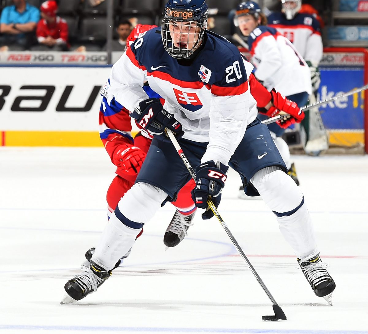 TORONTO, CANADA - DECEMBER 31: Slovakia's Adam Ruzicka #20 skates with the puck during preliminary round action against Russia at the 2017 IIHF World Junior Championship. (Photo by Matt Zambonin/HHOF-IIHF Images)