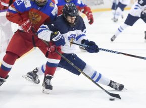 POPRAD, SLOVAKIA - APRIL 22: Russia's Ivan Muranov #23 battles with Finland's Toni Utunen #2 for the puck during semifinal round action at the 2017 IIHF Ice Hockey U18 World Championship. (Photo by Andrea Cardin/HHOF-IIHF Images)