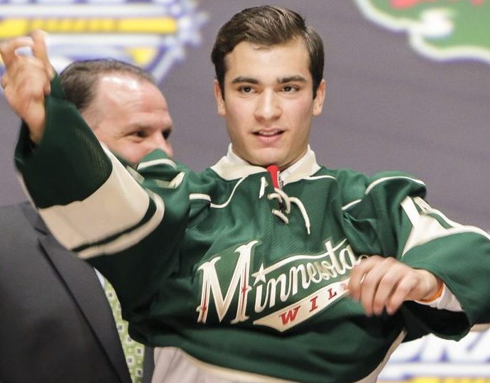 June 24, 2016: Luke Kunin dons his Wild sweater after he was selected by Minnesota as the 15th pick in the first round of the 2016 NHL Entry Draft at First Niagara Center in Buffalo, NY (Photo by John Crouch/Icon Sportswire.)