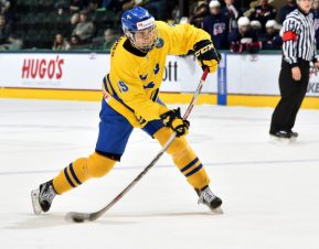 GRAND FORKS, NORTH DAKOTA - APRIL 16: Sweden's Timothy Liljegren #19 lets a shot go during preliminary round action against the U.S. at the 2016 IIHF Ice Hockey U18 World Championship. (Photo by Minas Panagiotakis/HHOF-IIHF Images)