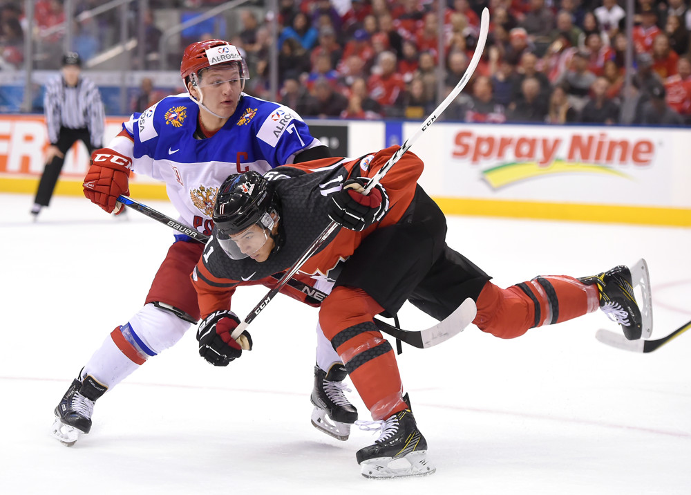 TORONTO, ON - DECEMBER 26: Canada forward Mathieu Joseph (11) collides with Russia forward Kirill Kaprizov (7) during the World junior Hockey Championships on December 26, 2016, at the Air Canada Centre in Toronto, Ontario. (Photo by Dan Hamilton/Icon Sportswire)