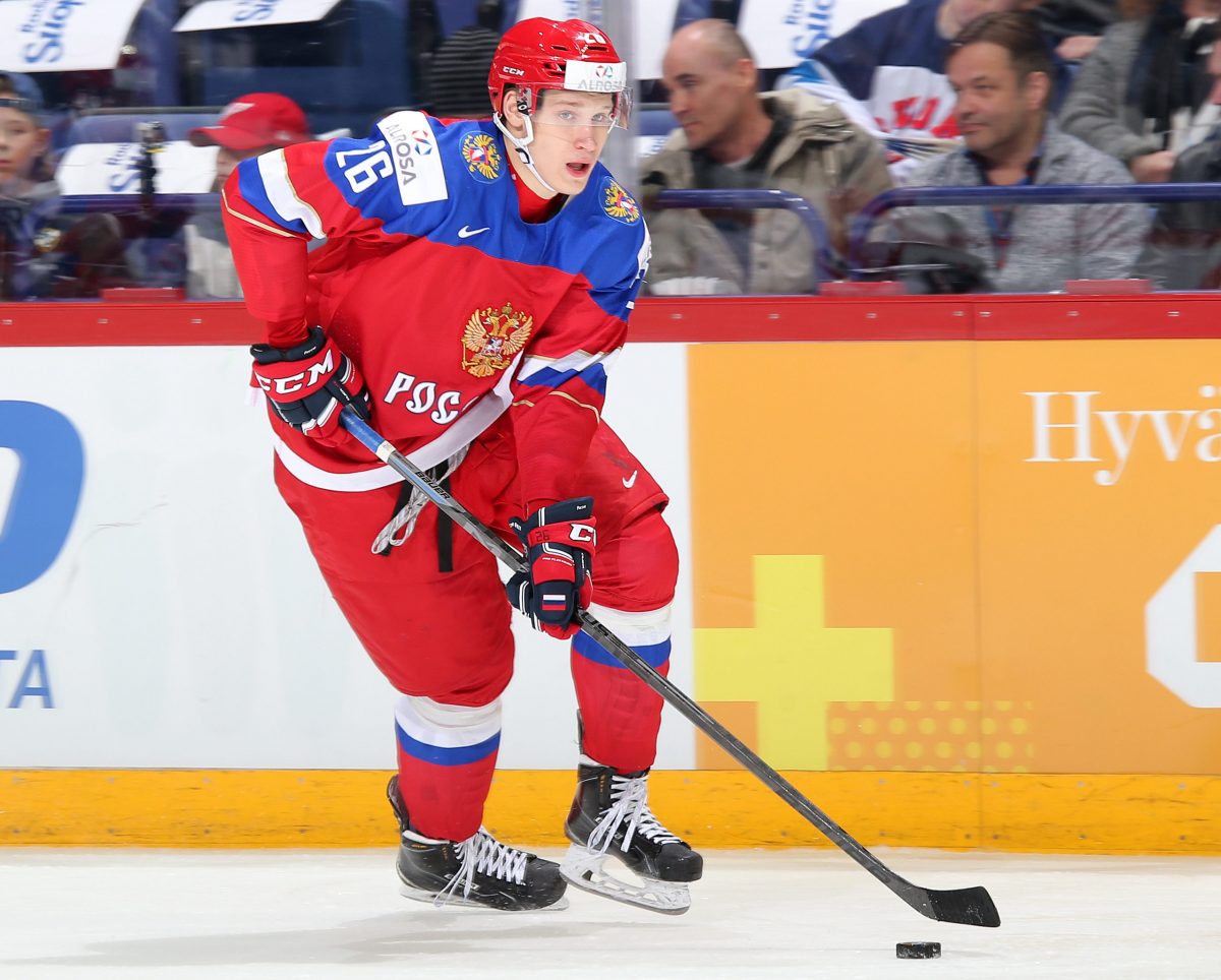 HELSINKI, FINLAND - DECEMBER 26: Russia's Yegor Korshkov #26 skates with the puck during preliminary round action against the Czech Republic at the 2016 IIHF World Junior Championship. (Photo by Andre Ringuette/HHOF-IIHF Images)