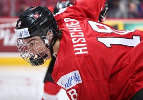 MONTREAL, CANADA - DECEMBER 27: Switzerland's Nico Hischier #18 leans in for the face-off during preliminary round action against the Czech Republic at the 2017 IIHF World Junior Championship. (Photo by Andre Ringuette/HHOF-IIHF Images)