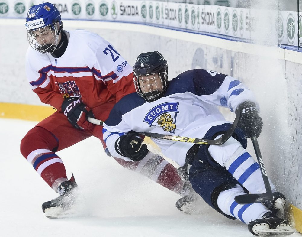 POPRAD, SLOVAKIA - APRIL 20: Czech Republic's Filip Chytil #20 bodychecks Finland's Aleksi Anttalainen #4 during quarterfinal round action at the 2017 IIHF Ice Hockey U18 World Championship. (Photo by Andrea Cardin/HHOF-IIHF Images)