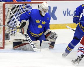 CHELYABINSK, RUSSIA - APRIL 29: Sweden's Olof Linbom #1 makes a glove save against the Czech Republic's Adam Gajarsky #11 whlie David Gustafsson #13 defends during bronze medal game action at the 2018 IIHF Ice Hockey U18 World Championship. (Photo by Steve Kingsman/HHOF-IIHF Images)