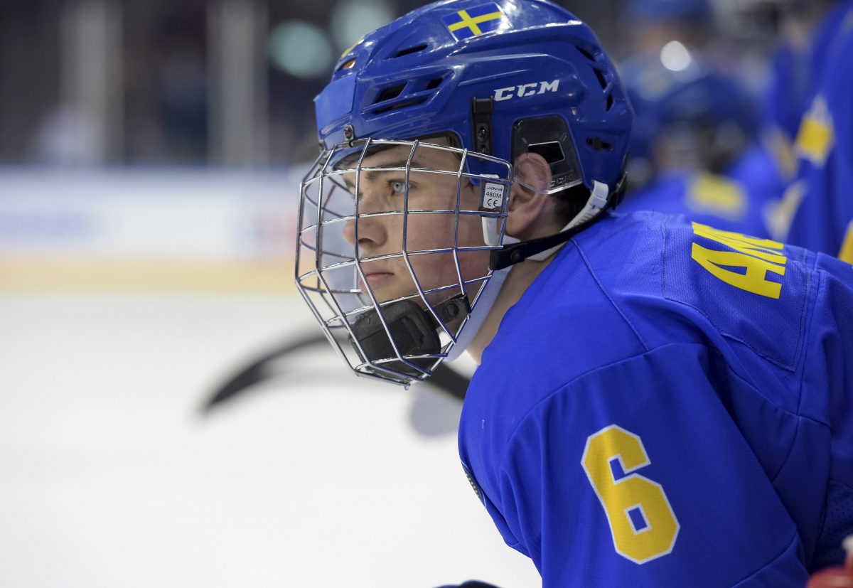 MAGNITOGORSK, RUSSIA - APRIL 19: Sweden's Axel Andersson #6 looks on during preliminary round action at the 2018 IIHF Ice Hockey U18 World Championship. (Photo by Steve Kingsman/HHOF-IIHF Images)
