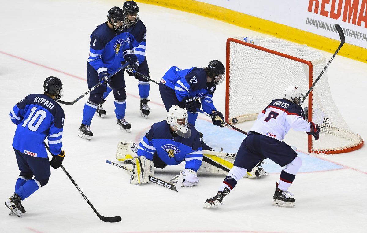 CHELYABINSK, RUSSIA - APRIL 29: USA's Trevor Janicke #7 scores on Finland's Justus Annunen #31 while his teammates Lassi Thomson #6, Kristian Tanus #27, Rasmus Kupari #10 and Kim Nousiainen #29 look on during gold medal game action at the 2018 IIHF Ice Hockey U18 World Championship. (Photo by Andrea Cardin/HHOF-IIHF Images)