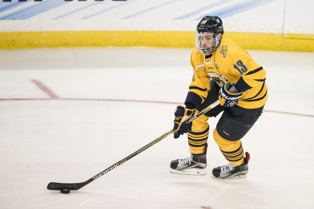 April 09, 2016: Chase Priskie (13) of Quinnipiac during the 2016 NCAA Frozen Four championship game between North Dakota and Quinnipiac at Amalie Arena in Tampa, FL. (Photograph by Roy K. Miller/Icon Sportswire)