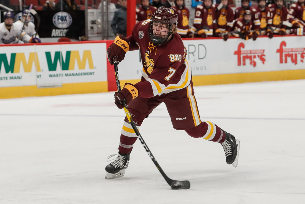 GLENDALE, AZ - DECEMBER 28: Minnesota-Duluth Bulldogs defenseman Scott Perunovich (7) takes a shot during the college hockey game between the Minnesota-Duluth Bulldogs and the Minnesota State Mavericks on December 28, 2018 at Gila River Arena in Glendale, Arizona. (Photo by Kevin Abele/Icon Sportswire)