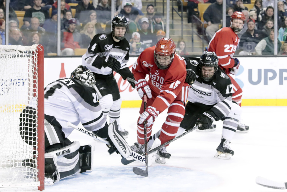 BOSTON, MA - MARCH 17: Boston University Terriers forward Shane Bowers (15) stopped by Providence Friars goaltender Hayden Hawkey (31) on the doorstep during the Hockey East championship game between the Boston University Terriers and the Providence College Friars on March 18, 2018, at TD Garden in Boston, Massachusetts. The Terriers defeated the Friars 2-0. (Photo by Fred Kfoury III/Icon Sportswire)