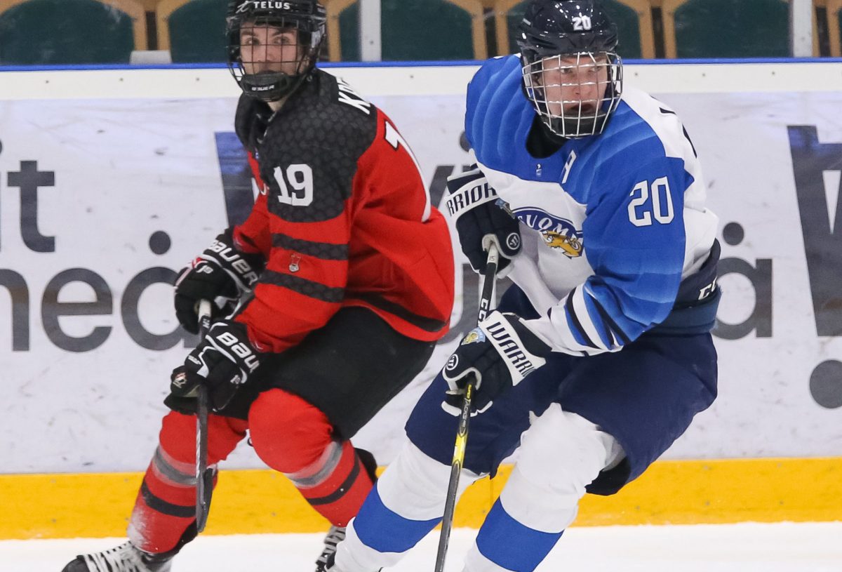 UMEA, SWEDEN - APRIL 18: Finland's Anton Lundell #20 stickhandles the puck against Canada's Peyton Krebs #19 during preliminary round action of the 2019 IIHF Ice Hockey U18 World Championship at A3 Arena on Apirl 18, 2019 in Umea, Sweden. (Photo by Chris Tanouye/HHOF-IIHF Images)