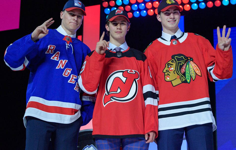 VANCOUVER, BC - JUNE 21:  Kaapo Kakko, Jack Hughes, and Kirby Dach pose for a photo onstage after being selected in the top three in the first round of the 2019 NHL Draft at Rogers Arena on June 21, 2019 in Vancouver, British Columbia, Canada. (Photo by Derek Cain/Icon Sportswire)