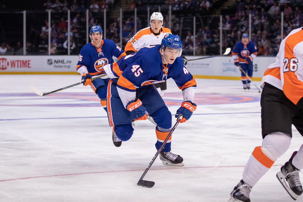 UNIONDALE, NY - SEPTEMBER 16: New York Islanders Defenseman Noah Dobson (45) is in pursuit of the puck in a pre-season game against the Philadelphia Flyers on September 16, 2018, at the NYCB Live Nassau Coliseum in Uniondale, NY. (Photo by John McCreary/Icon Sportswire)