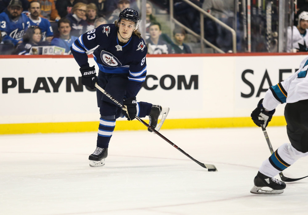 WINNIPEG, MB – March 12: Winnipeg Jets defenseman Sami Niku (83) prepares to take a shot during the regular season game between the Winnipeg Jets and the San Jose Sharks on March 12, 2019 at the Bell MTS Place in Winnipeg MB. (Photo by Terrence Lee/Icon Sportswire)