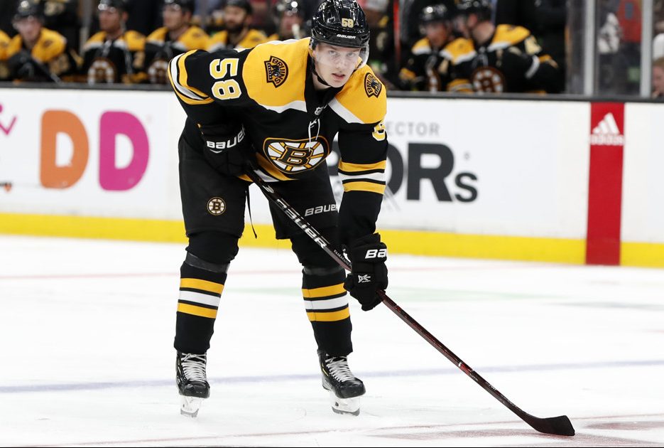 BOSTON, MA - SEPTEMBER 26: Boston Bruins defenseman Urho Vaakanainen (58) eyes a face off during a preseason game between the Boston Bruins and the Detroit Red Wings on September 26, 2018, at TD Garden in Boston, Massachusetts. The Red Wings defeated the Bruins 3-2 (OT). (Photo by Fred Kfoury III/Icon Sportswire)
