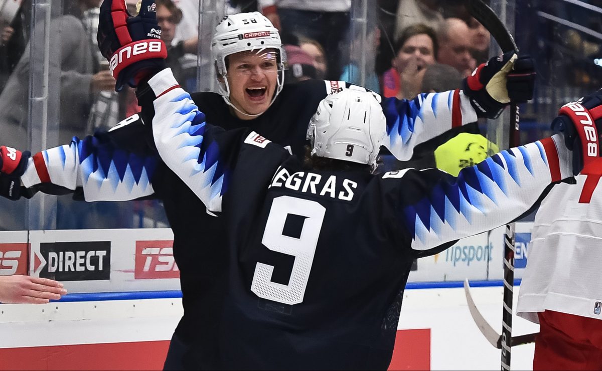 OSTRAVA, CZECH REPUBLIC - DECEMBER 29: USAÕs Arthur Kaliyev #28 celebrates with Trevor Zegras #9 after scoring a third period goal against Russia during preliminary round action at the 2020 IIHF World Junior Championship at Ostravar Arena on December 29, 2019 in Ostrava, Czech Republic. (Photo by Andrea Cardin/HHOF-IIHF Images)