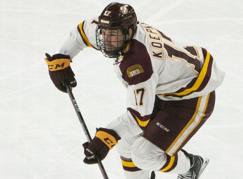 BUFFALO, NY - APRIL 13: Minnesota Duluth Bulldogs Forward Cole Koepke (17) skates with the puck during the second period of the NCAA Hockey Frozen Four championship game between the Massachusetts Minutemen and the Minnesota Duluth Bulldogs on April 13, 2019, at KeyBank Center in Buffalo, NY. (Photo by Gregory Fisher/Icon Sportswire)