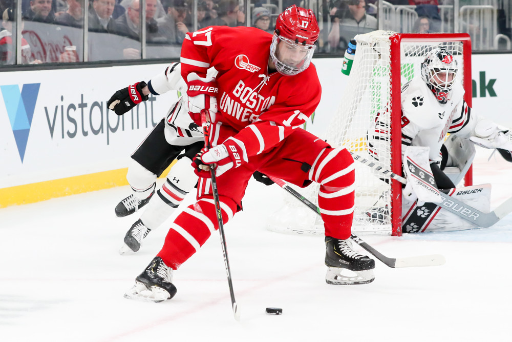 BOSTON, MA - FEBRUARY 10: Boston University Terriers forward Jake Wise (17) spins around to take a shot on goal during Beanpot Tournament Championship game between the Northeastern Huskies and Boston University Terriers on February 10, 2020, at TD Garden in Boston, Massachusetts. (Photo by Mark Box/Icon Sportswire)
