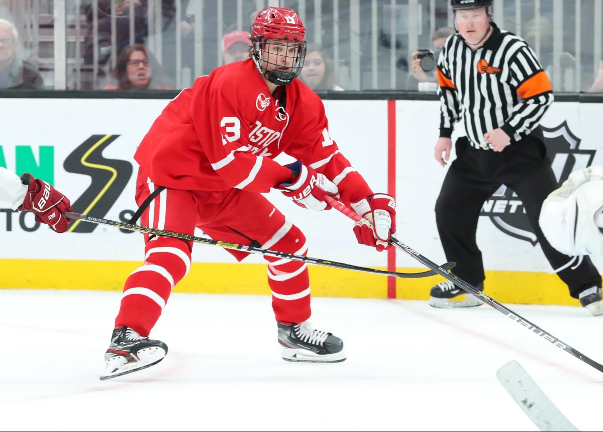 BOSTON, MA - FEBRUARY 03: Boston University Terriers forward Trevor Zegras (13) takes a shot on goal during the game between Boston College and Boston University on February 03, 2020, at TD Garden in Boston, Massachusetts. (Photo by Mark Box/Icon Sportswire)