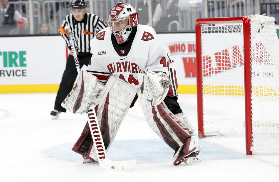 BOSTON, MA - FEBRUARY 03: Harvard University Crimson goaltender Mitchell Gibson (44) eyes a face off during a Beanpot semi-final between the Harvard Crimson and the Northeastern Huskies on February 3, 2020, at TD garden in Boston, Massachusetts. (Photo by Fred Kfoury III/Icon Sportswire)