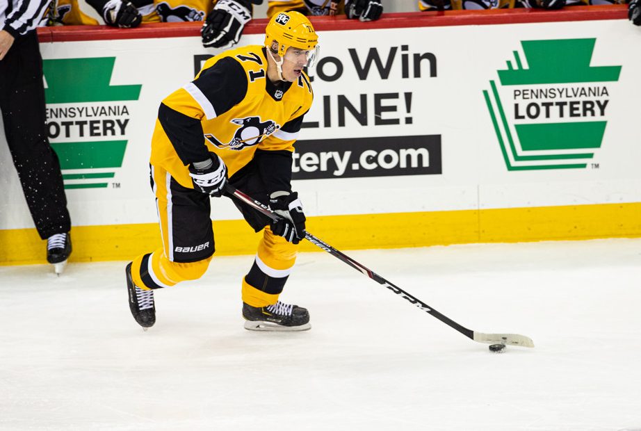PITTSBURGH, PA - MARCH 09: Pittsburgh Penguins Center Evgeni Malkin (71) handles the puck during the NHL game between the Pittsburgh Penguins and the New York Rangers on March 9, 2021, at PPG Paints Arena in Pittsburgh, PA. (Photo by Mark Alberti/Icon Sportswire)