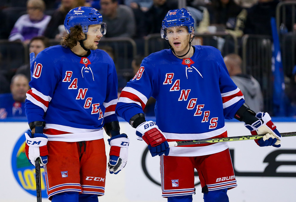 New York Rangers left wing Artemi Panarin (10) looks to pass the puck  during the third period of an NHL hockey game against the Ottawa Senators,  Thursday, March 2, 2023, in New