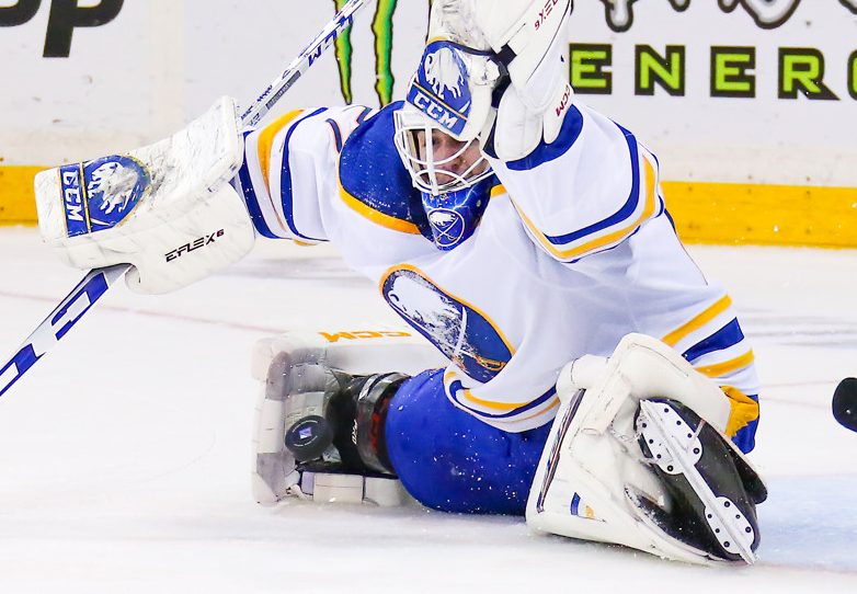 Daniel Briere of the Buffalo Sabres (48) moves the puck against Peter Schaefer of the Ottawa