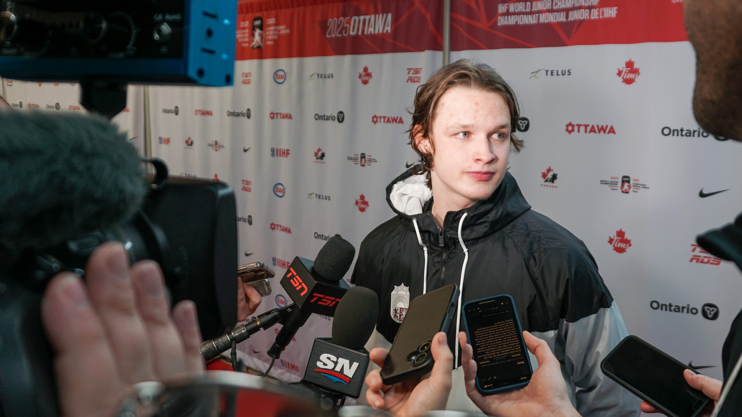 Latvian goaltender Linards Feldbergs speaks with the media following a 55-save shootout victory over Canada.
